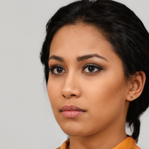 Neutral asian young-adult female with medium  black hair and brown eyes