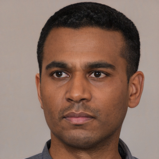 Neutral black young-adult male with short  black hair and brown eyes