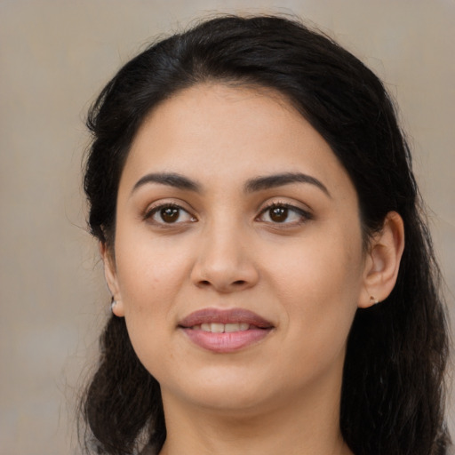 Joyful asian young-adult female with long  black hair and brown eyes