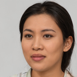 Joyful asian young-adult female with medium  brown hair and brown eyes