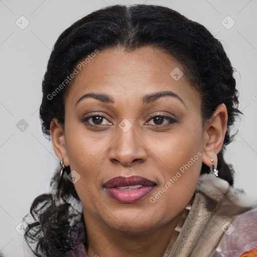 Joyful latino adult female with medium  brown hair and brown eyes