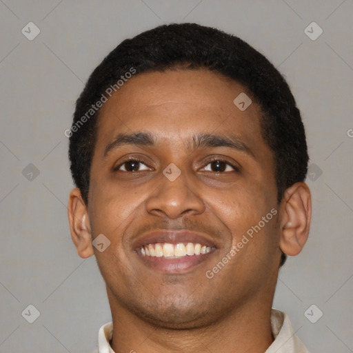 Joyful latino young-adult male with short  brown hair and brown eyes