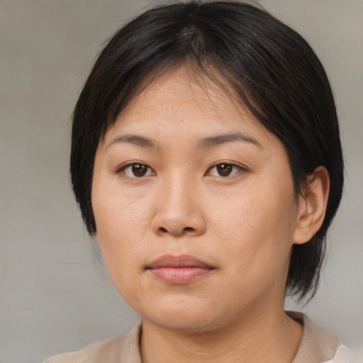 Neutral asian young-adult female with medium  brown hair and brown eyes