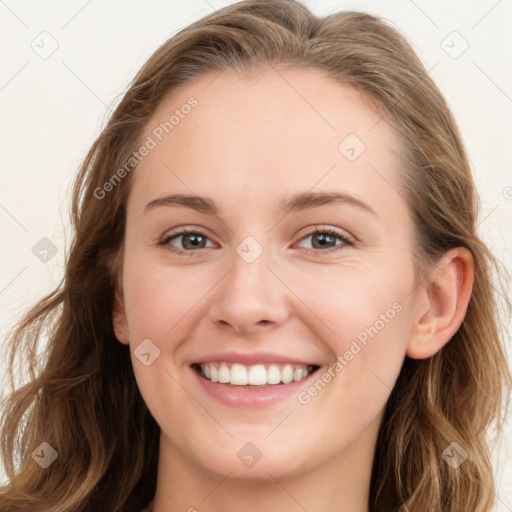 Joyful white young-adult female with long  brown hair and blue eyes