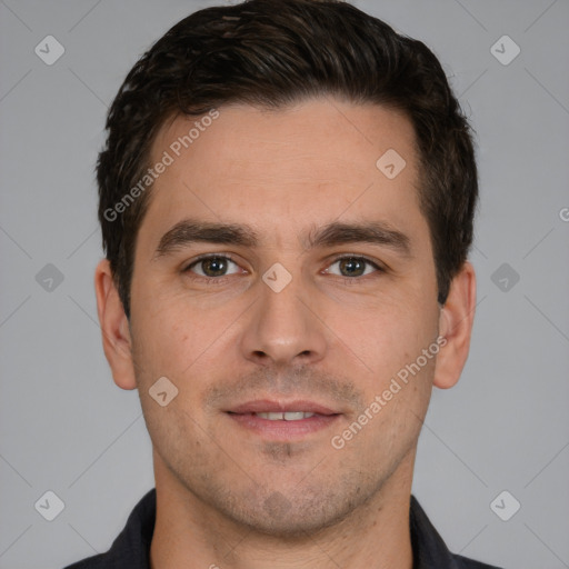 Joyful white young-adult male with short  brown hair and brown eyes