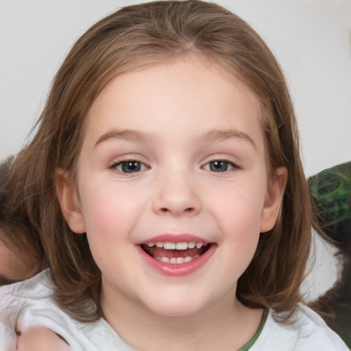 Joyful white child female with medium  brown hair and brown eyes