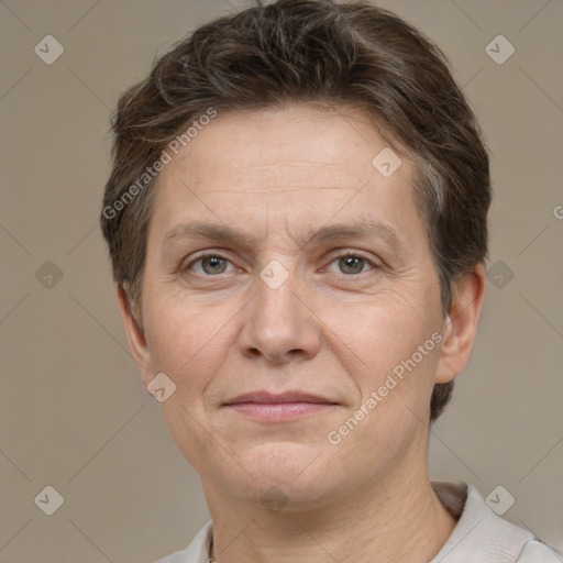 Joyful white adult female with short  brown hair and brown eyes