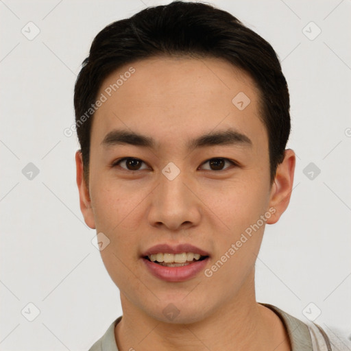 Joyful asian young-adult male with short  black hair and brown eyes