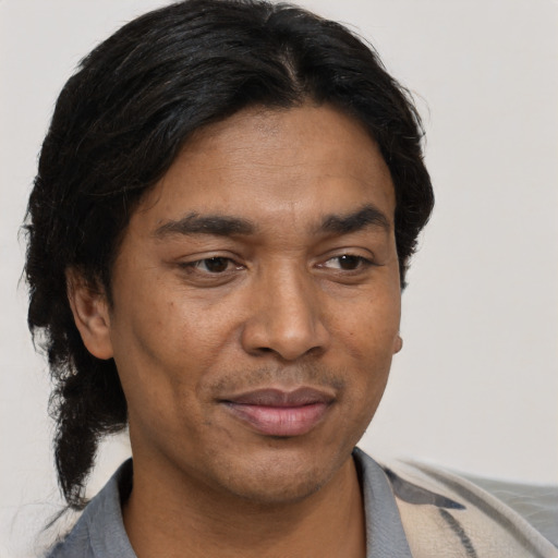 Joyful asian adult male with short  brown hair and brown eyes