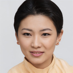 Joyful asian young-adult female with short  brown hair and brown eyes