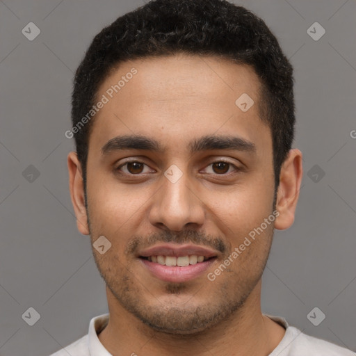 Joyful latino young-adult male with short  brown hair and brown eyes