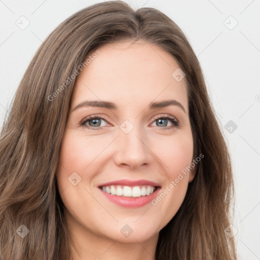 Joyful white young-adult female with long  brown hair and green eyes