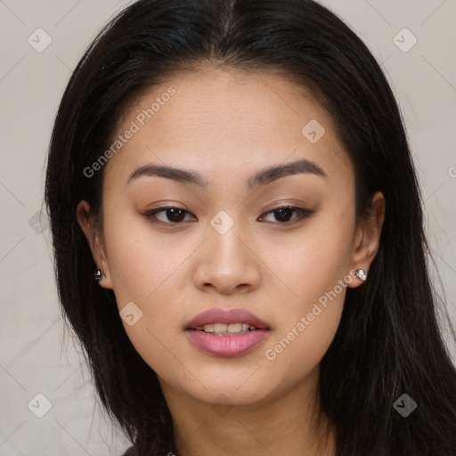 Joyful asian young-adult female with long  brown hair and brown eyes