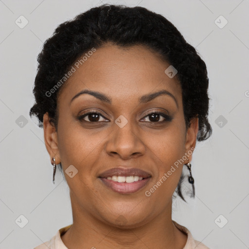 Joyful black adult female with short  brown hair and brown eyes