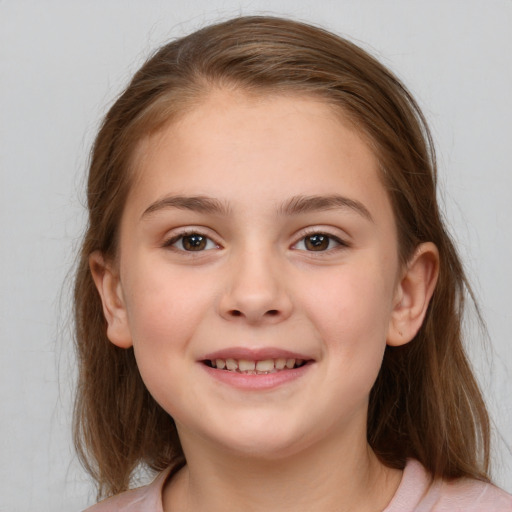 Joyful white child female with medium  brown hair and brown eyes