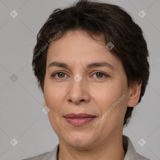 Joyful white adult female with short  brown hair and brown eyes