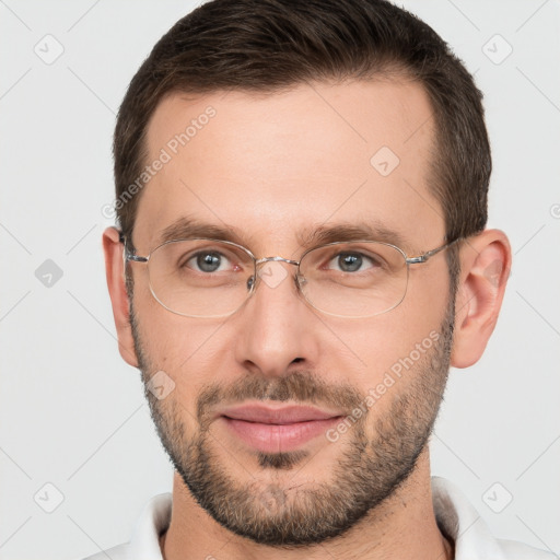 Joyful white adult male with short  brown hair and brown eyes