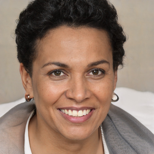 Joyful white adult female with short  brown hair and brown eyes