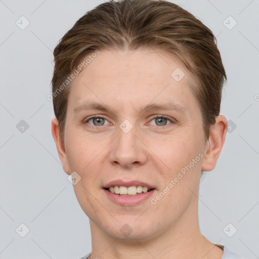 Joyful white young-adult female with short  brown hair and grey eyes