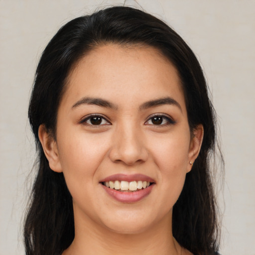 Joyful white young-adult female with long  brown hair and brown eyes