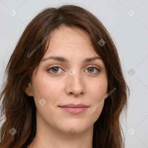 Joyful white young-adult female with long  brown hair and green eyes