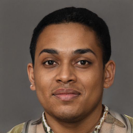 Joyful black young-adult male with short  black hair and brown eyes