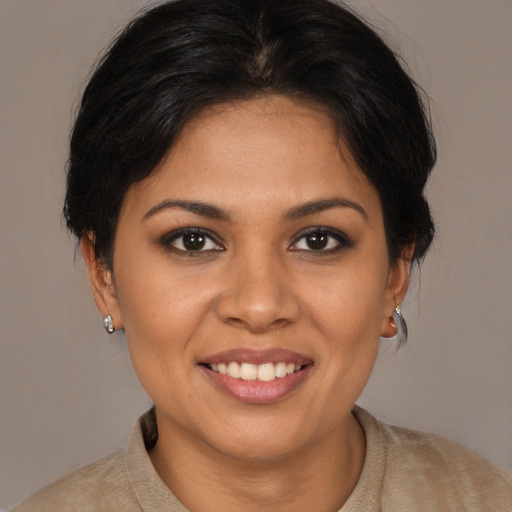 Joyful white young-adult female with medium  brown hair and brown eyes