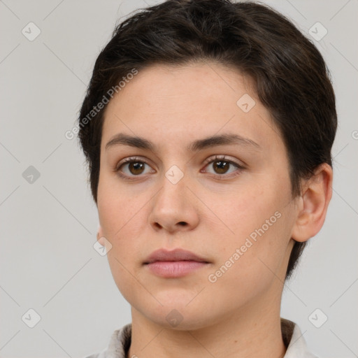 Neutral white young-adult female with short  brown hair and brown eyes