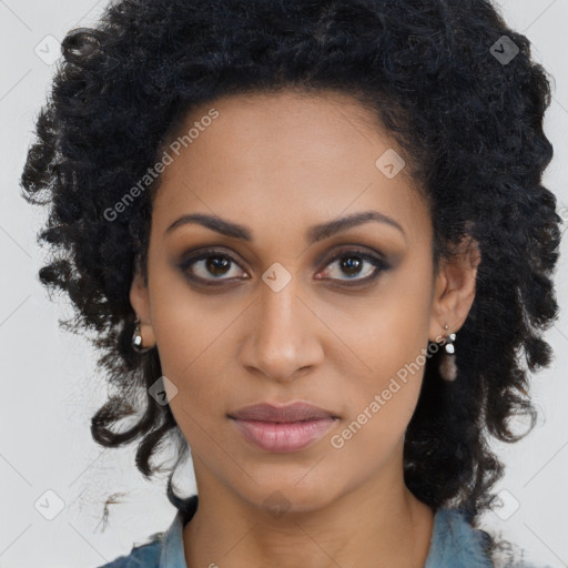 Joyful black young-adult female with long  brown hair and brown eyes