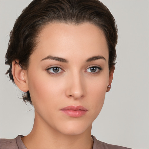 Neutral white young-adult female with short  brown hair and brown eyes