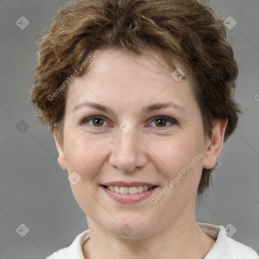 Joyful white adult female with short  brown hair and brown eyes