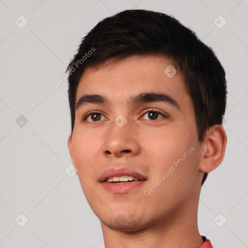 Joyful white young-adult male with short  black hair and brown eyes