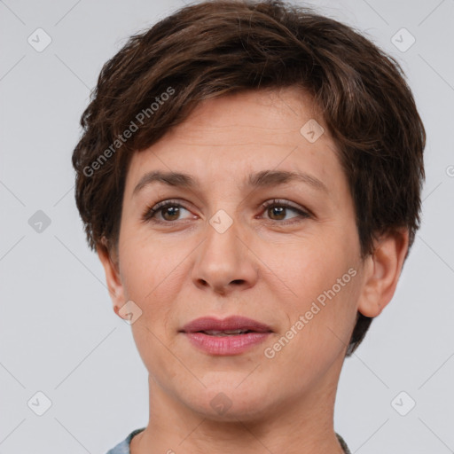 Joyful white adult female with short  brown hair and brown eyes