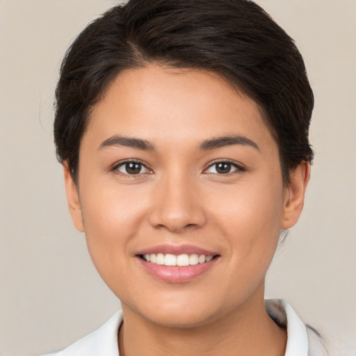 Joyful white young-adult female with short  brown hair and brown eyes