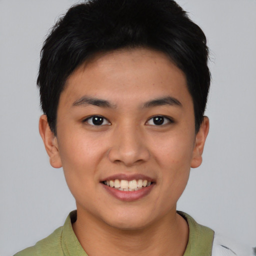 Joyful asian young-adult female with short  brown hair and brown eyes