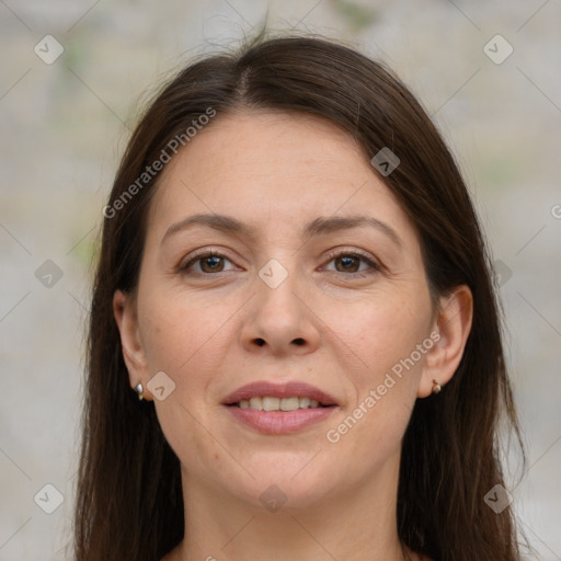 Joyful white adult female with long  brown hair and brown eyes