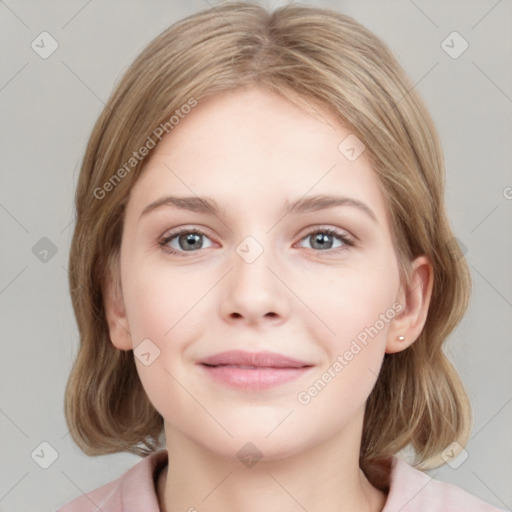 Joyful white young-adult female with medium  brown hair and blue eyes