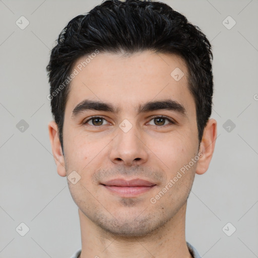 Joyful white young-adult male with short  black hair and brown eyes