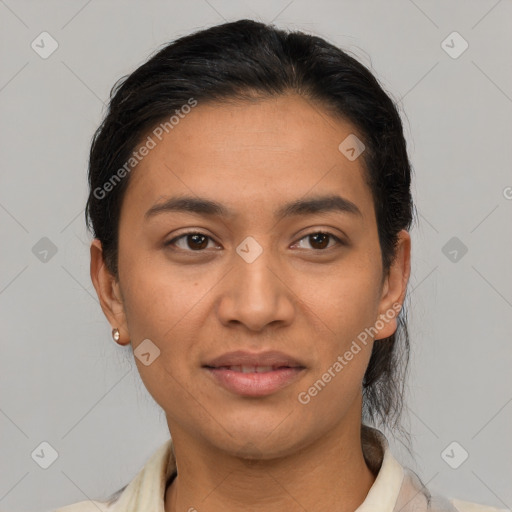 Joyful latino young-adult female with short  black hair and brown eyes