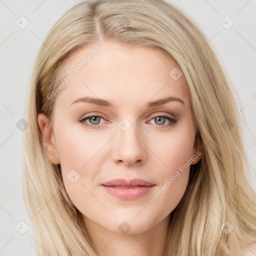 Joyful white young-adult female with long  brown hair and blue eyes