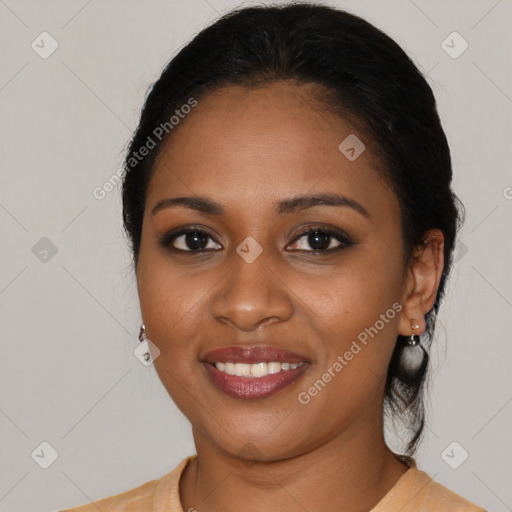 Joyful black young-adult female with medium  black hair and brown eyes