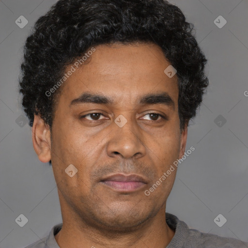 Neutral latino adult male with short  black hair and brown eyes