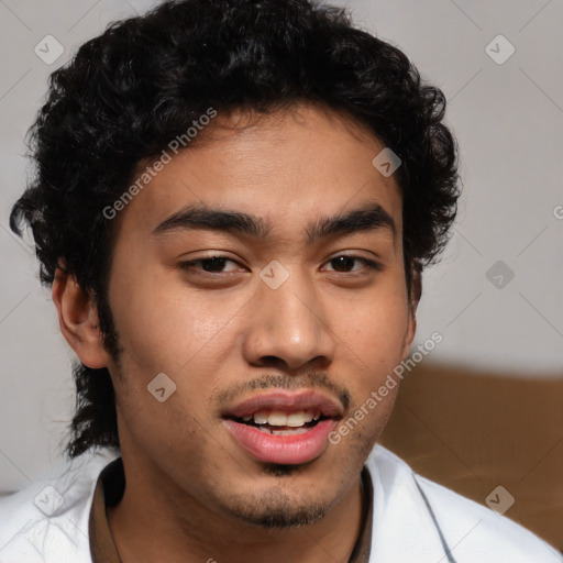 Joyful latino young-adult male with short  brown hair and brown eyes