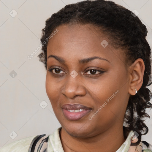 Joyful black young-adult female with medium  black hair and brown eyes