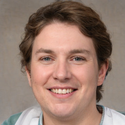 Joyful white adult male with medium  brown hair and brown eyes