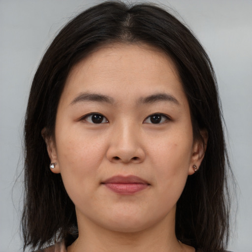 Neutral asian young-adult female with medium  brown hair and brown eyes