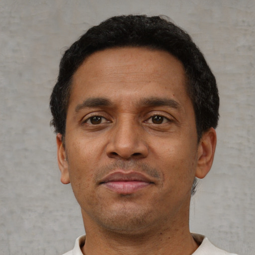 Neutral black adult male with short  brown hair and brown eyes