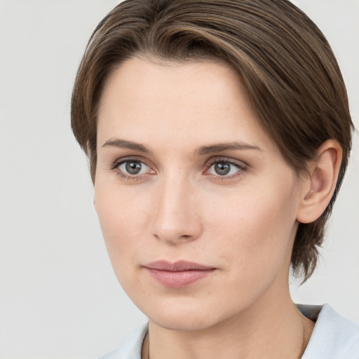 Neutral white young-adult female with medium  brown hair and grey eyes