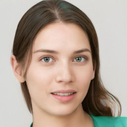 Joyful white young-adult female with medium  brown hair and green eyes