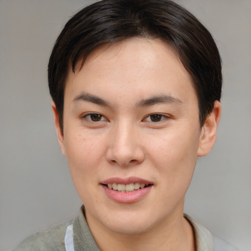 Joyful asian young-adult female with short  brown hair and brown eyes